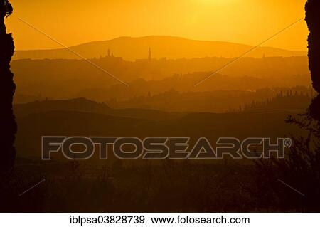 "Sunset over the hills of Tuscany, with Siena in the distance, Tuscany, Province of Siena, Italy, Europe" View Large Photo Image Stock Photo - "Sunset over the hills of Tuscany, with Siena in the distance, Tuscany, Province of Siena, Italy, Europe". Fotosearch