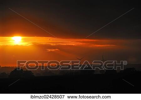 "Sunset over the Mecklenburg landscape after a thunderstorm, two wind turbines at the back, Othenstorf, Mecklenburg-Western Pomerania, Germany, Europe" View Large Photo Image Stock Photo - "Sunset over the Mecklenburg landscape after a thunderstorm, two wind turbines at the back, Othenstorf, Mecklenburg-Western Pomerania, Germany, Europe". Fotosearch