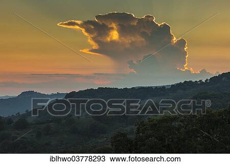 Stock Image - "Sunset over the Nebrodi Nature Park, near San Teodoro, Sicily, Italy, Europe". Fotosearch