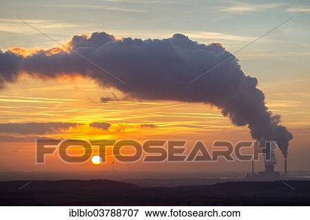 "Sunset over the towns of Voerde and Dinslaken from Hunxe, STEAG power plant Voerde, coal-fired power plant, Ruhr area, North Rhine-Westphalia, Germany, Europe" View Large Photo Image Stock Photo - "Sunset over the towns of Voerde and Dinslaken from Hunxe, STEAG power plant Voerde, coal-fired power plant, Ruhr area, North Rhine-Westphalia, Germany, Europe". Fotosearch