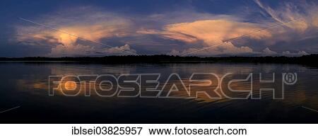 Stock Photo - "Sunset, storm clouds, Rio Cuyabeno, Cuyabeno River, Ecuador, South America". Fotosearch