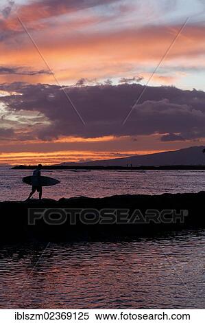 "Sunset, surfer on his way home, Waikiki, Honolulu, O'ahu, Hawaii, USA" View Large Photo Image Stock Photography - "Sunset, surfer on his way home, Waikiki, Honolulu, O'ahu, Hawaii, USA". Fotosearch