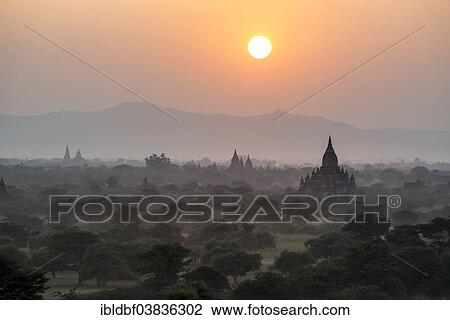 "Sunset, temples, stupas and pagodas in the temple complex of the Plateau of Bagan, Mandalay Division, Myanmar or Burma" View Large Photo Image Stock Image - "Sunset, temples, stupas and pagodas in the temple complex of the Plateau of Bagan, Mandalay Division, Myanmar or Burma". Fotosearch