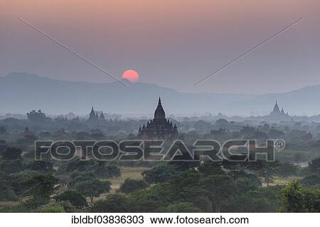"Sunset, temples, stupas and pagodas in the temple complex of the Plateau of Bagan, Mandalay Division, Myanmar or Burma" View Large Photo Image Stock Image - "Sunset, temples, stupas and pagodas in the temple complex of the Plateau of Bagan, Mandalay Division, Myanmar or Burma". Fotosearch