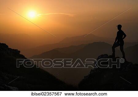 "Sunset with a silhouette of a mountain climber, Geisshorn Mountain, Tannheim Valley, Tyrol, Austria, Europe" View Large Photo Image Stock Photo - "Sunset with a silhouette of a mountain climber, Geisshorn Mountain, Tannheim Valley, Tyrol, Austria, Europe". Fotosearch