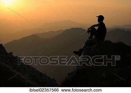 "Sunset with a silhouette of a mountain climber, Geisshorn Mountain, Tannheim Valley, Tyrol, Austria, Europe" View Large Photo Image Stock Photograph - "Sunset with a silhouette of a mountain climber, Geisshorn Mountain, Tannheim Valley, Tyrol, Austria, Europe". Fotosearch