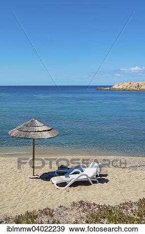 Stock Photo - "Sunshade and beach chair, beach in Lâ€™Ile-Rousse, Corsica, France, Europe". Fotosearch