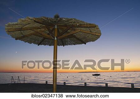 "Sunshade at sunset by the seaside, Novalja, Pag Island, Adriatic Sea, Gulf of Kvarner, Croatia, Europe" View Large Photo Image Stock Photo - "Sunshade at sunset by the seaside, Novalja, Pag Island, Adriatic Sea, Gulf of Kvarner, Croatia, Europe". Fotosearch