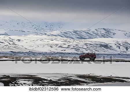 Stock Photograph - "Super Jeep on a road, winter landscape, Icelandic Highlands, Iceland, Europe". Fotosearch
