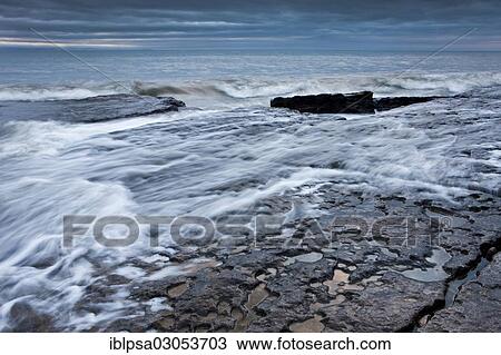 Stock Image - "Surf on the rocky coast, Dunraven Bay, Glamorgan Heritage Coast, Wales, United Kingdom, Europe". Fotosearch