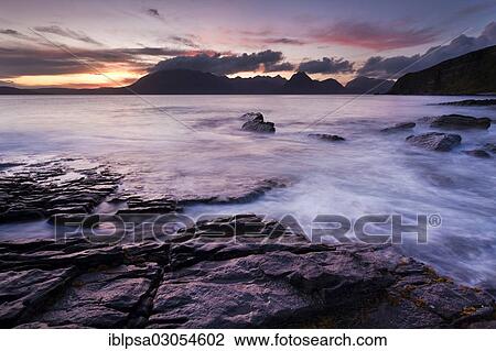 Stock Image - "Surf with cliffs, Elgol, Isle of Skye, Scotland, United Kingdom, Europe". Fotosearch
