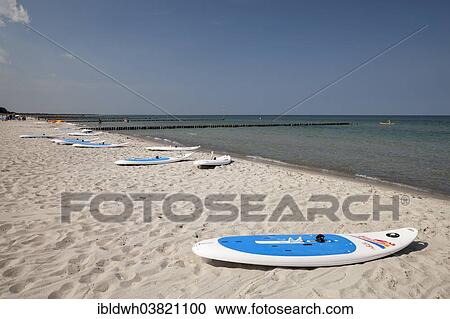 Stock Image - "Surfboards on the beach, Baltic Sea peninsula of Fischland-Darss-Zingst, Baltic Sea resort of Zingst, Mecklenburg-Vorpommern, Germany, Europe". Fotosearch