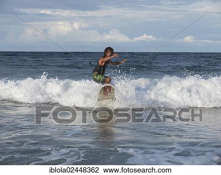 "Surfer, 40, surfing a wave, Playa Cocles, Puerto Viejo de Talamanca, Costa Rica, Central America, North America" View Large Photo Image Stock Image - "Surfer, 40, surfing a wave, Playa Cocles, Puerto Viejo de Talamanca, Costa Rica, Central America, North America". Fotosearch
