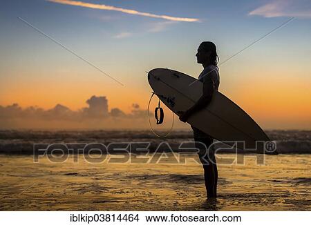 "Surfer the sunset, Sanur Beach, Bali, Indonesia, Asia" View Large Photo Image Picture - "Surfer the sunset, Sanur Beach, Bali, Indonesia, Asia". Fotosearch