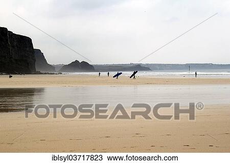 "Surfers on the beach at low tide, Watergate Bay, Cornwall, England, United Kingdom, Europe" View Large Photo Image Stock Image - "Surfers on the beach at low tide, Watergate Bay, Cornwall, England, United Kingdom, Europe". Fotosearch