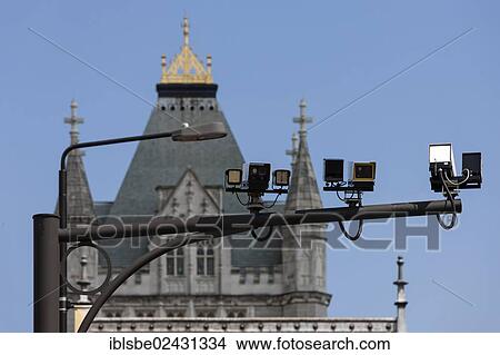 Picture - "Surveillance cameras, video surveillance, in front of a tower of Tower Bridge, London, England, United Kingdom, Europe". Fotosearch