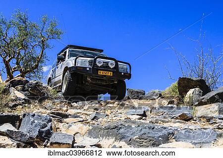 "SUV driving down rock steps, Tsauchab, Namibia, Africa" View Large Photo Image Stock Image - "SUV driving down rock steps, Tsauchab, Namibia, Africa". Fotosearch