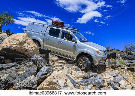 "SUV driving down rock steps, Tsauchab, Namibia, Africa" View Large Photo Image Stock Photo - "SUV driving down rock steps, Tsauchab, Namibia, Africa". Fotosearch