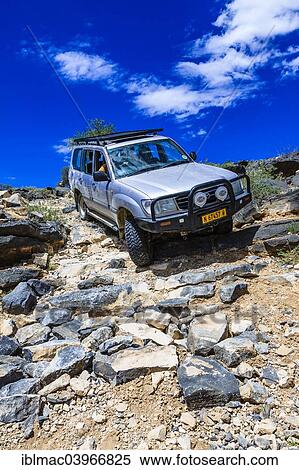 "SUV driving down steep rock steps, Tsauchab, Namibia, Africa" View Large Photo Image Stock Photography - "SUV driving down steep rock steps, Tsauchab, Namibia, Africa". Fotosearch
