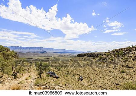 "SUV driving through arid landscape, Tsauchab, Namibia, Africa" View Large Photo Image Stock Photo - "SUV driving through arid landscape, Tsauchab, Namibia, Africa". Fotosearch