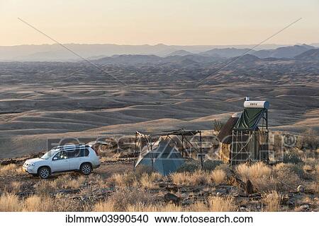 "SUV next to tent and small hut, Valle de la luna, Namib Naukluft, Namibia, Africa" View Large Photo Image Stock Image - "SUV next to tent and small hut, Valle de la luna, Namib Naukluft, Namibia, Africa". Fotosearch