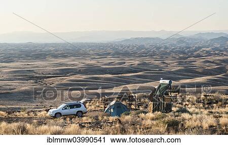"SUV next to tent and small hut, Valle de la luna, Namib Naukluft, Namibia, Africa" View Large Photo Image Stock Image - "SUV next to tent and small hut, Valle de la luna, Namib Naukluft, Namibia, Africa". Fotosearch