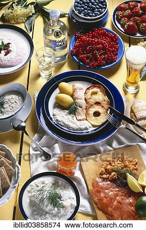 "Swedish national cuisine, smoked salmon, herring salad, poached salmon fillet with Jerusalem artichoke sauce and baked apples, cranberry parfait, beer, vodka" View Large Photo Image Picture - "Swedish national cuisine, smoked salmon, herring salad, poached salmon fillet with Jerusalem artichoke sauce and baked apples, cranberry parfait, beer, vodka". Fotosearch