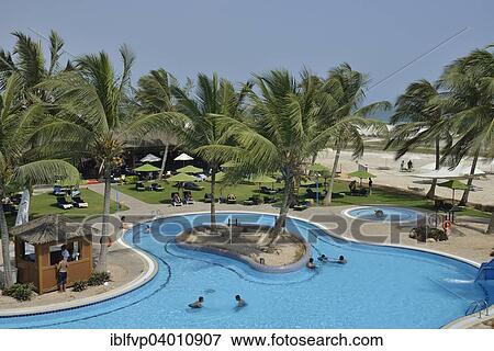 "Swimming pool of the Hilton Hotel, Salalah, Dhofar Region, Orient, Oman, Asia" View Large Photo Image Stock Photo - "Swimming pool of the Hilton Hotel, Salalah, Dhofar Region, Orient, Oman, Asia". Fotosearch