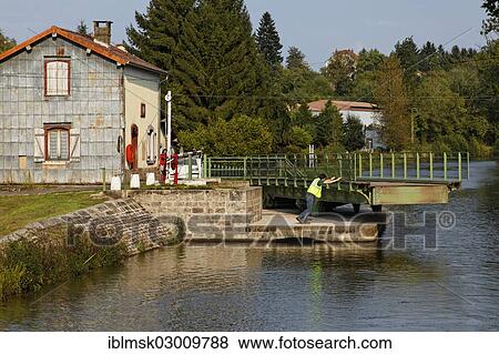 Stock Photo - "Swing Bridge and keeper's house on the Canal des Vosges, formerly Canal de l'Est, Selles, Vesoul, Haute-Saone, Franche-Comte, France, Europe". Fotosearch