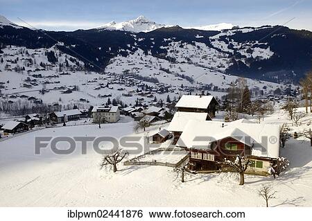 Stock Photograph - "Swiss chalets in winter, Grindelwald, Swiss Alps, Switzerland, Europe". Fotosearch