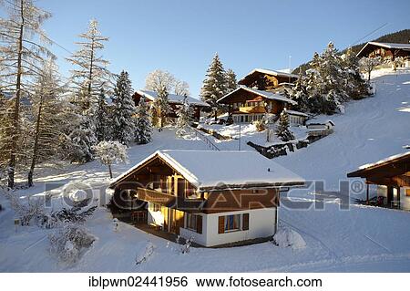 Stock Photograph - "Swiss chalets in winter, near Grindelwald, Swiss Alps, Switzerland, Europe". Fotosearch