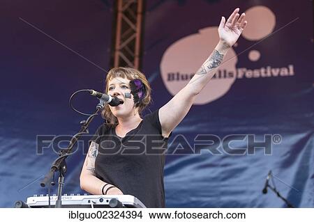 "Swiss singer and musician Anna Aaron playing live at the Blue Balls Festival, pavilion at the lake, in Lucerne, Switzerland, Europe" View Large Photo Image Picture - "Swiss singer and musician Anna Aaron playing live at the Blue Balls Festival, pavilion at the lake, in Lucerne, Switzerland, Europe". Fotosearch