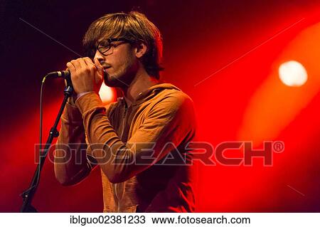Stock Image - "Swiss singer and musician Michel Gsell, alias Guy Vincent, performing live in the Schueuer concert hall, Lucerne, Switzerland, Europe". Fotosearch