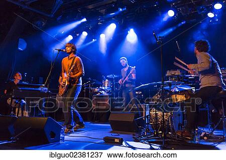 "Swiss singer and musician Michel Gsell, alias Guy Vincent, performing live with a band in the Schueuer concert hall, Lucerne, Switzerland, Europe" View Large Photo Image Stock Photo - "Swiss singer and musician Michel Gsell, alias Guy Vincent, performing live with a band in the Schueuer concert hall, Lucerne, Switzerland, Europe". Fotosearch