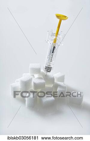 "Syringe filled with insulin, insulin injection sticking in a pile of sugar cubes" View Large Photo Image Stock Image - "Syringe filled with insulin, insulin injection sticking in a pile of sugar cubes". Fotosearch