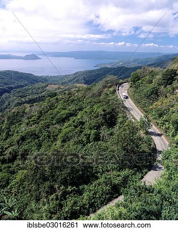 Stock Image - "Taal volcano, lake Taal and a road, Batangas, Luzon, Philippines, Asia". Fotosearch