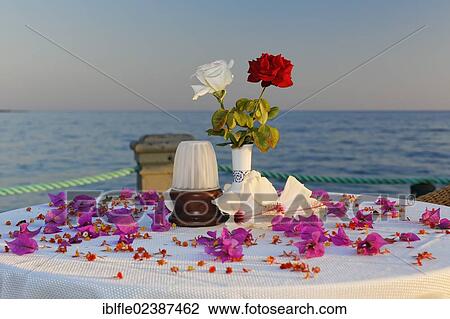 "Table decorated with flowers on a jetty on the Turkish Riviera, Turkey, Asia" View Large Photo Image Stock Image - "Table decorated with flowers on a jetty on the Turkish Riviera, Turkey, Asia". Fotosearch