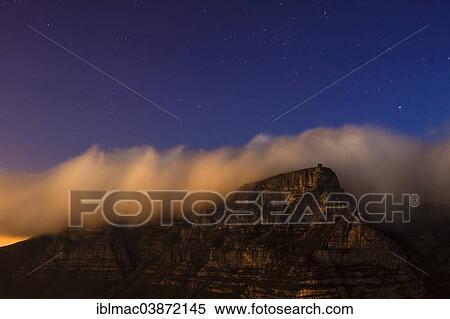 "Table Mountain with """"tablecloth"""" clouds at night, Cape Town, Western Cape, South Africa, Africa" View Large Photo Image Stock Photography - "Table Mountain with """"tablecloth"""" clouds at night, Cape Town, Western Cape, South Africa, Africa". Fotosearch