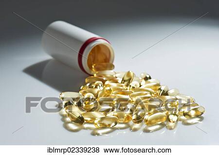 Tablet tube with spilled tablets View Large Photo Image Stock Photo - Tablet tube with spilled tablets. Fotosearch