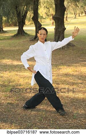 "Tai Chi, demonstration in an olive grove, Regine Zanini, two-time silver medalist of the Tai Chi Championships 2012, Menton, French Riviera, Alpes-Maritimes, Provence-Alpes-Cote d’Azur, France, Europe" View Large Photo Image Stock Photo - "Tai Chi, demonstration in an olive grove, Regine Zanini, two-time silver medalist of the Tai Chi Championships 2012, Menton, French Riviera, Alpes-Maritimes, Provence-Alpes-Cote d’Azur, France, Europe". Fotosearch