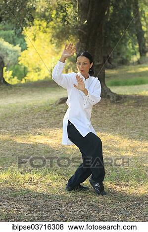 "Tai Chi, demonstration in an olive grove, Regine Zanini, two-time silver medalist of the Tai Chi Championships 2012, Menton, French Riviera, Alpes-Maritimes, Provence-Alpes-Cote d’Azur, France, Europe" View Large Photo Image Stock Photo - "Tai Chi, demonstration in an olive grove, Regine Zanini, two-time silver medalist of the Tai Chi Championships 2012, Menton, French Riviera, Alpes-Maritimes, Provence-Alpes-Cote d’Azur, France, Europe". Fotosearch