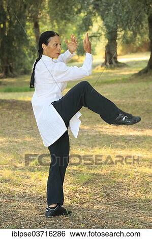 "Tai Chi, demonstration in an olive grove, Regine Zanini, two-time silver medalist of the Tai Chi Championships 2012, Menton, French Riviera, Alpes-Maritimes, Provence-Alpes-Cote d’Azur, France, Europe" View Large Photo Image Stock Photograph - "Tai Chi, demonstration in an olive grove, Regine Zanini, two-time silver medalist of the Tai Chi Championships 2012, Menton, French Riviera, Alpes-Maritimes, Provence-Alpes-Cote d’Azur, France, Europe". Fotosearch