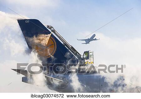 Stock Image - "Tail unit of an Airbus A340 of Lufthansa airlines during de-icing at Frankfurt Airport, Startbahn West Flughafen Frankfurt, Frankfurt am Main, Hesse, Germany, Europe". Fotosearch