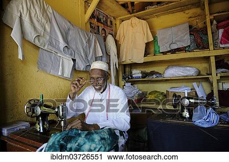 "Tailor at the market of Ngaoundere, Ngaoundere, Adamawa Region, Cameroon, Africa" View Large Photo Image Stock Image - "Tailor at the market of Ngaoundere, Ngaoundere, Adamawa Region, Cameroon, Africa". Fotosearch