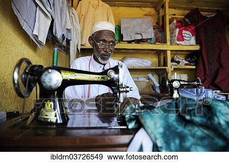 Stock Photo - "Tailor at the market of Ngaoundere, Ngaoundere, Adamawa Region, Cameroon, Africa". Fotosearch