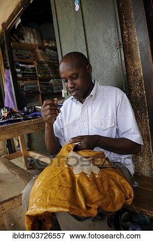 "Tailor at the market of Ngaoundere, Ngaoundere, Adamawa Region, Cameroon, Africa" View Large Photo Image Stock Photo - "Tailor at the market of Ngaoundere, Ngaoundere, Adamawa Region, Cameroon, Africa". Fotosearch