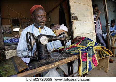 "Tailor at the market of Ngaoundere, Ngaoundere, Adamawa Region, Cameroon, Africa" View Large Photo Image Stock Photo - "Tailor at the market of Ngaoundere, Ngaoundere, Adamawa Region, Cameroon, Africa". Fotosearch