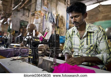 "Tailor in a former building of Meenakshi Amman Temple or Sri Meenakshi Sundareswarar Temple, Madurai, Tamil Nadu, India, Asia" View Large Photo Image Stock Photography - "Tailor in a former building of Meenakshi Amman Temple or Sri Meenakshi Sundareswarar Temple, Madurai, Tamil Nadu, India, Asia". Fotosearch