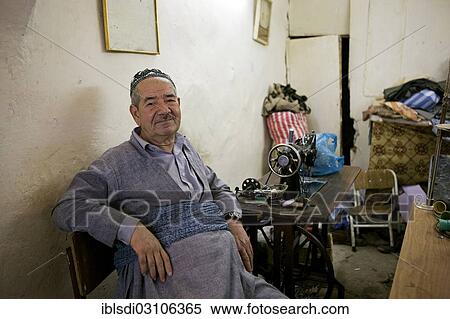 "Tailor in a tailor store, Arbil, Arbil, Iraqi Kurdistan, Iraq, Asia" View Large Photo Image Stock Photography - "Tailor in a tailor store, Arbil, Arbil, Iraqi Kurdistan, Iraq, Asia". Fotosearch