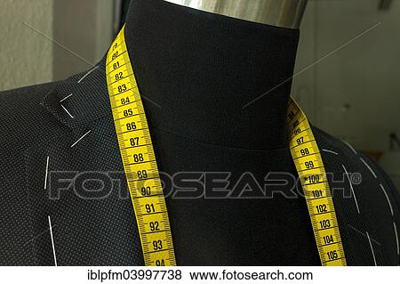 Stock Photo - "Tailor's cloth measuring tape around the neck of a clothes dummy, Germany, Europe". Fotosearch